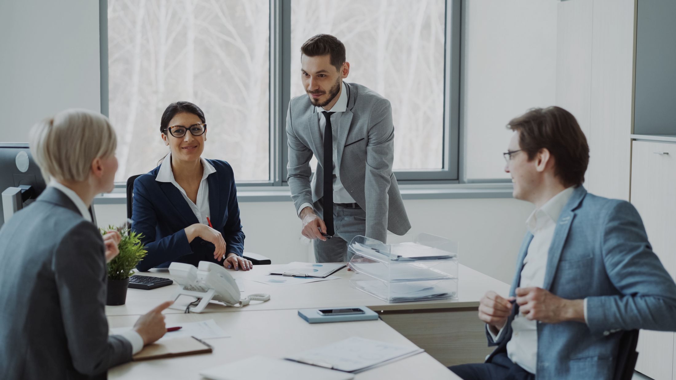Professional team discussing plans in a bright modern office