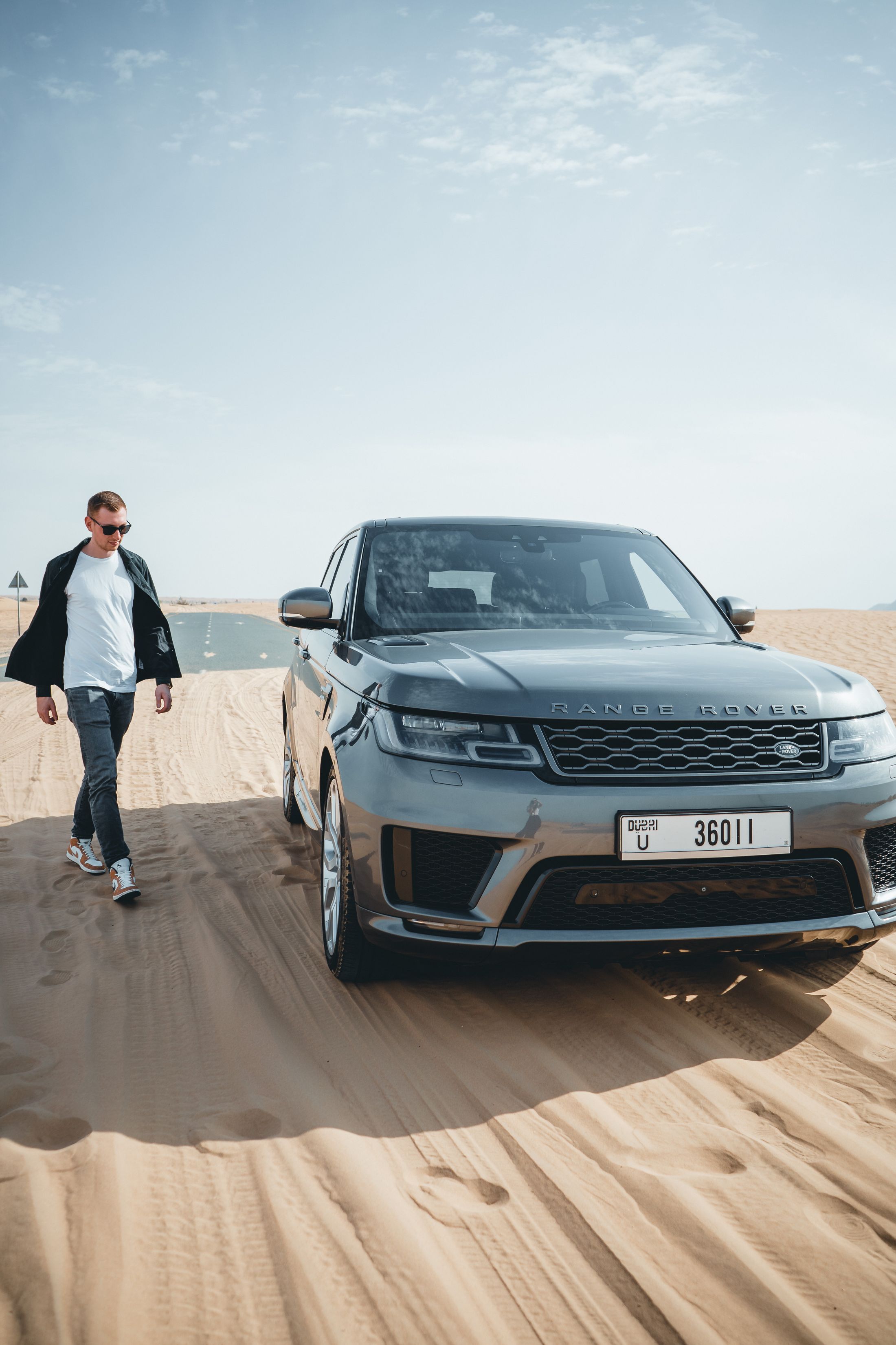 Luxury four-wheel-drive vehicle in the Dubai desert for a safari experience